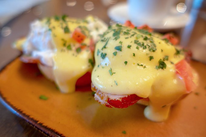 eggs Benedict on a brown platter