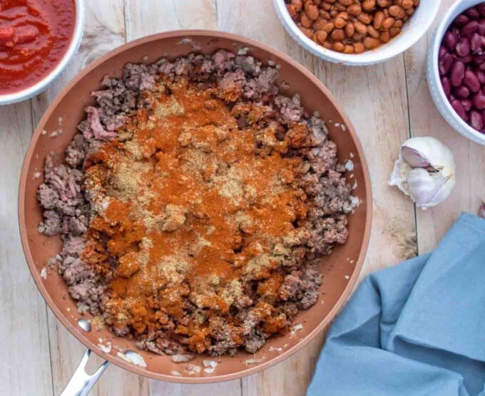 seasonings added to the pan with cooked ground beef