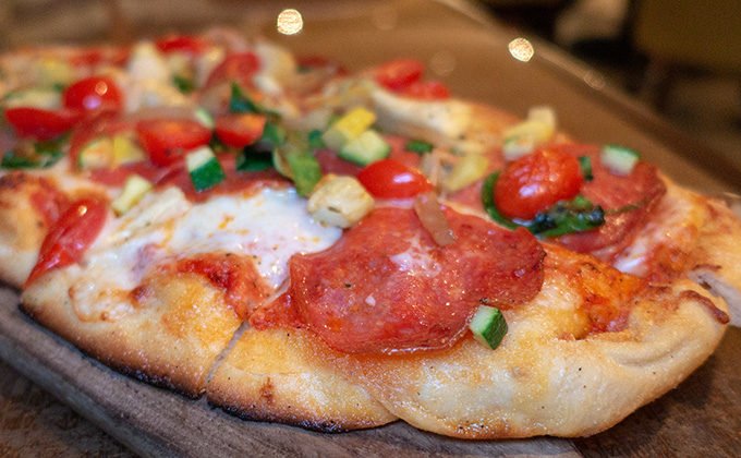 flatbread pizza with pepperoni and vegetables