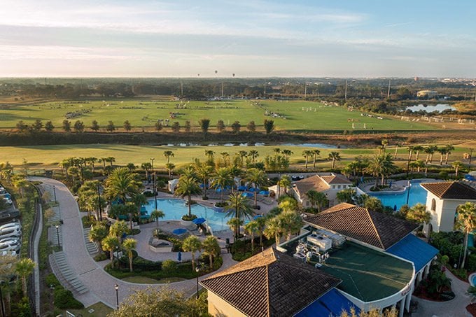 sunrise at the omni resort in orlando showing the pools and soccer fields