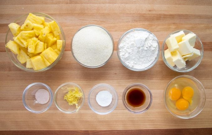 ingredients to make pineapple butter cake in small glass bowls