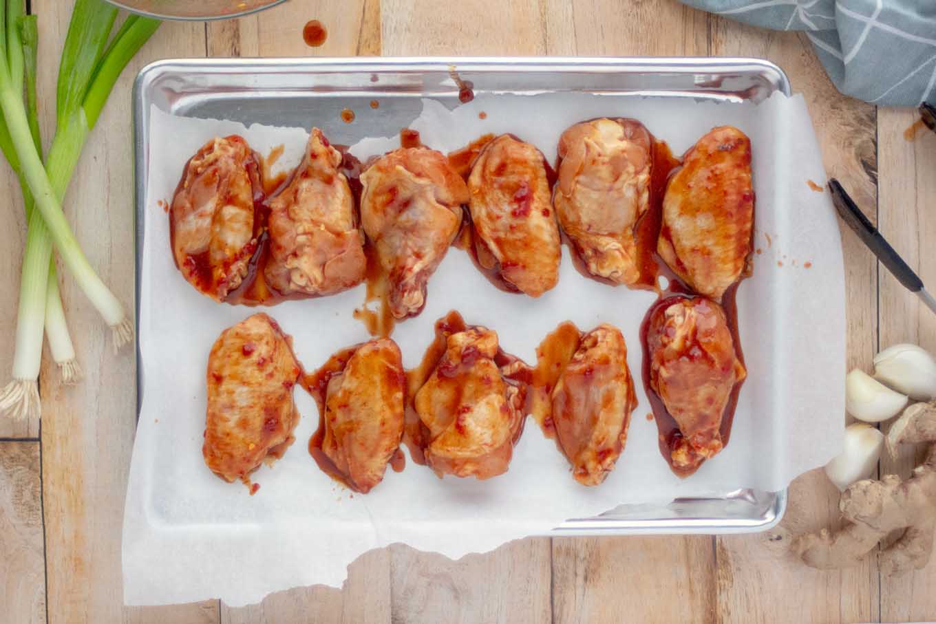 marinated wings on a sheetpan
