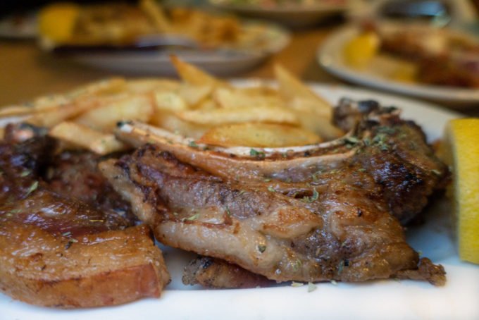 grilled lamb on a plate with french fries