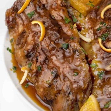 rack of chinese sticky ribs on a white platter