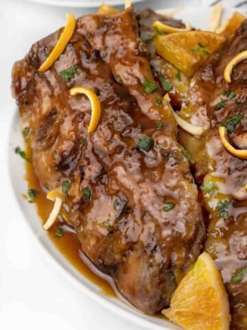 rack of chinese sticky ribs on a white platter