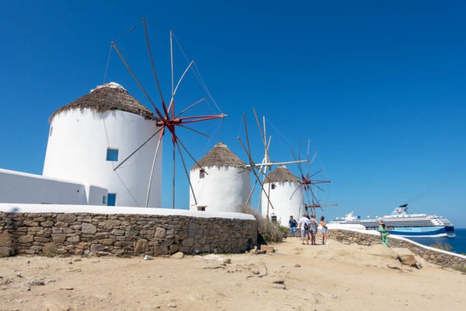 3 of the Windmills of Mykonos with a clear blue sky