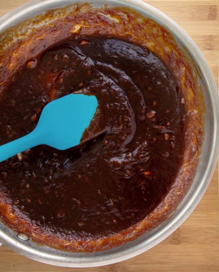Korean Barbecue sauce in a bowl  with a blue silicone spatula
