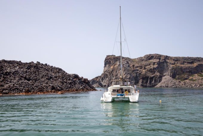 catamaran in the Aegean sea by shoreline