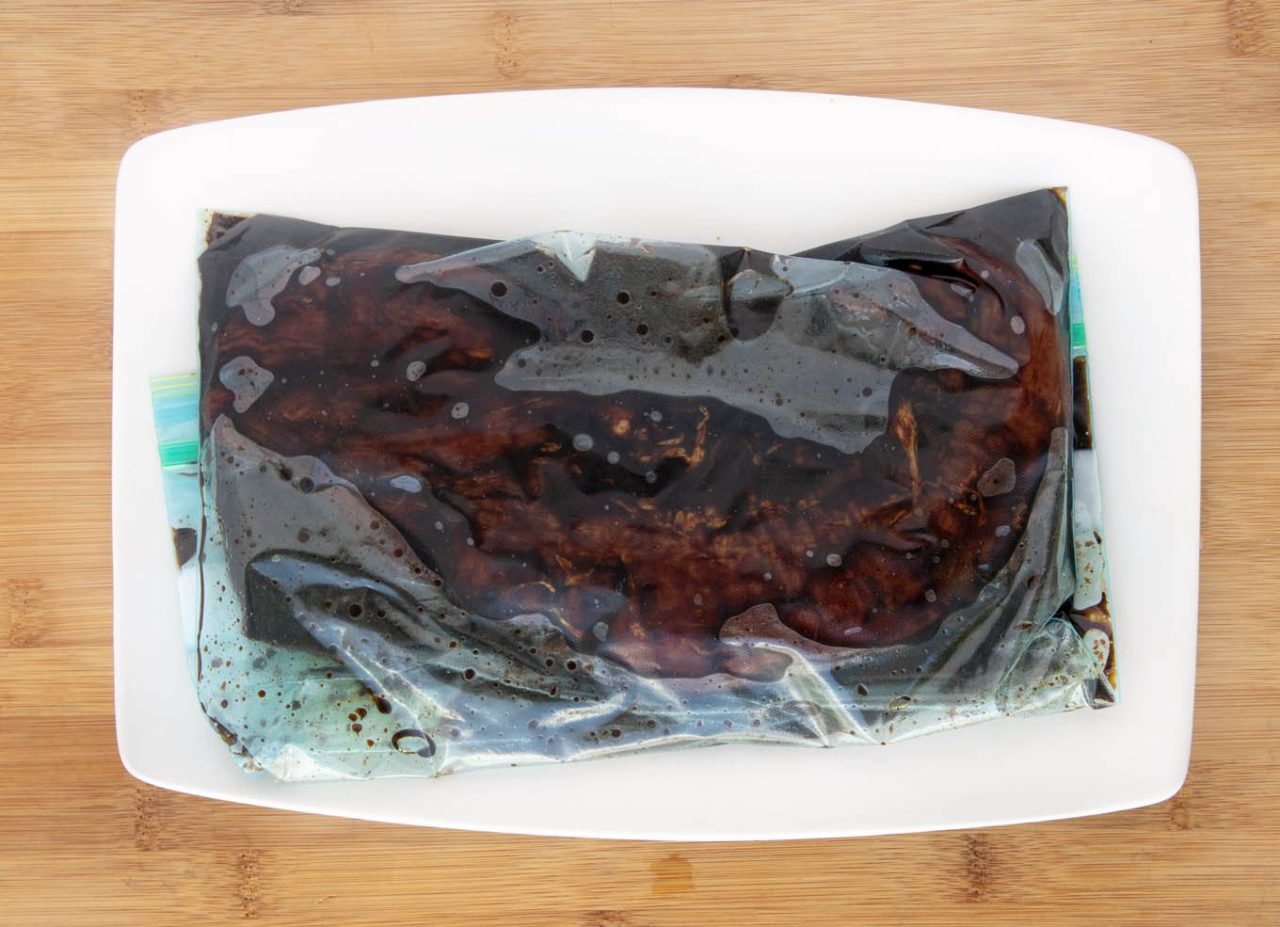 ziplock bag with marinade and pork tenderloin