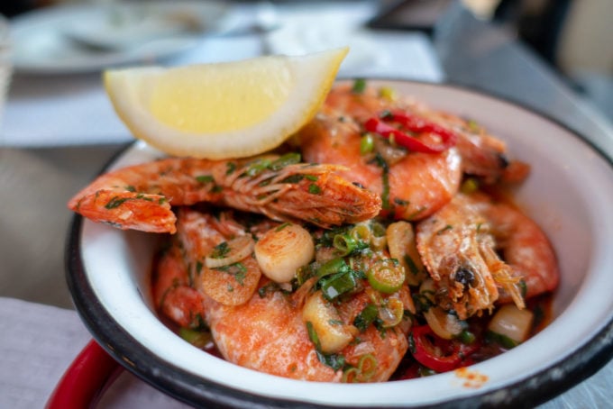 Garlic Shrimp with the shell on in a small bowl at Damas restaurant in Lisbon