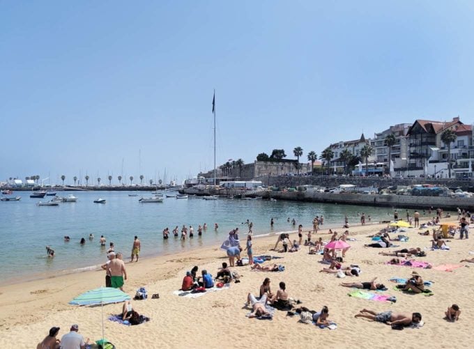 people on the beach in Cascais, Portugal