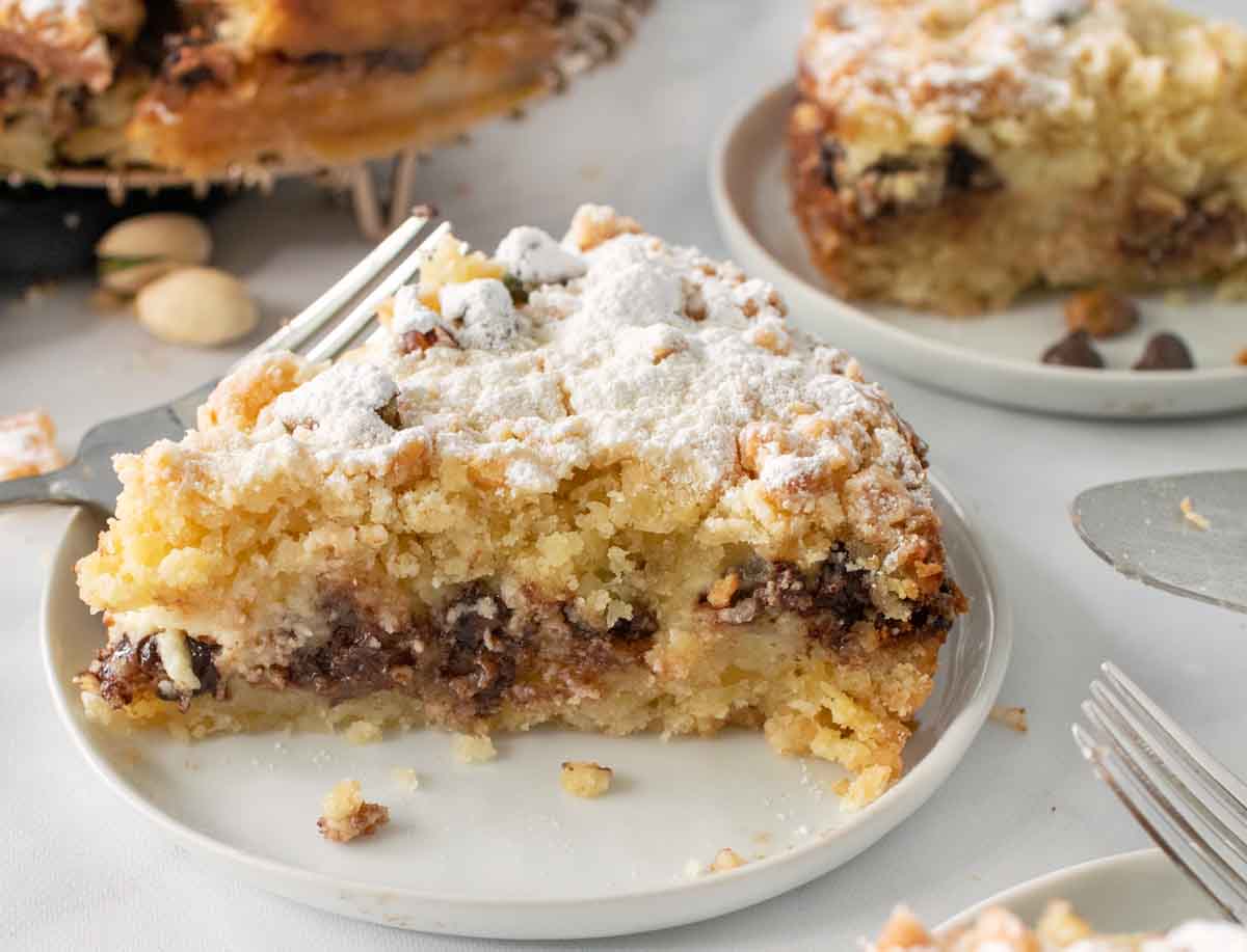 ricotta chocolate chip cake on white plate.