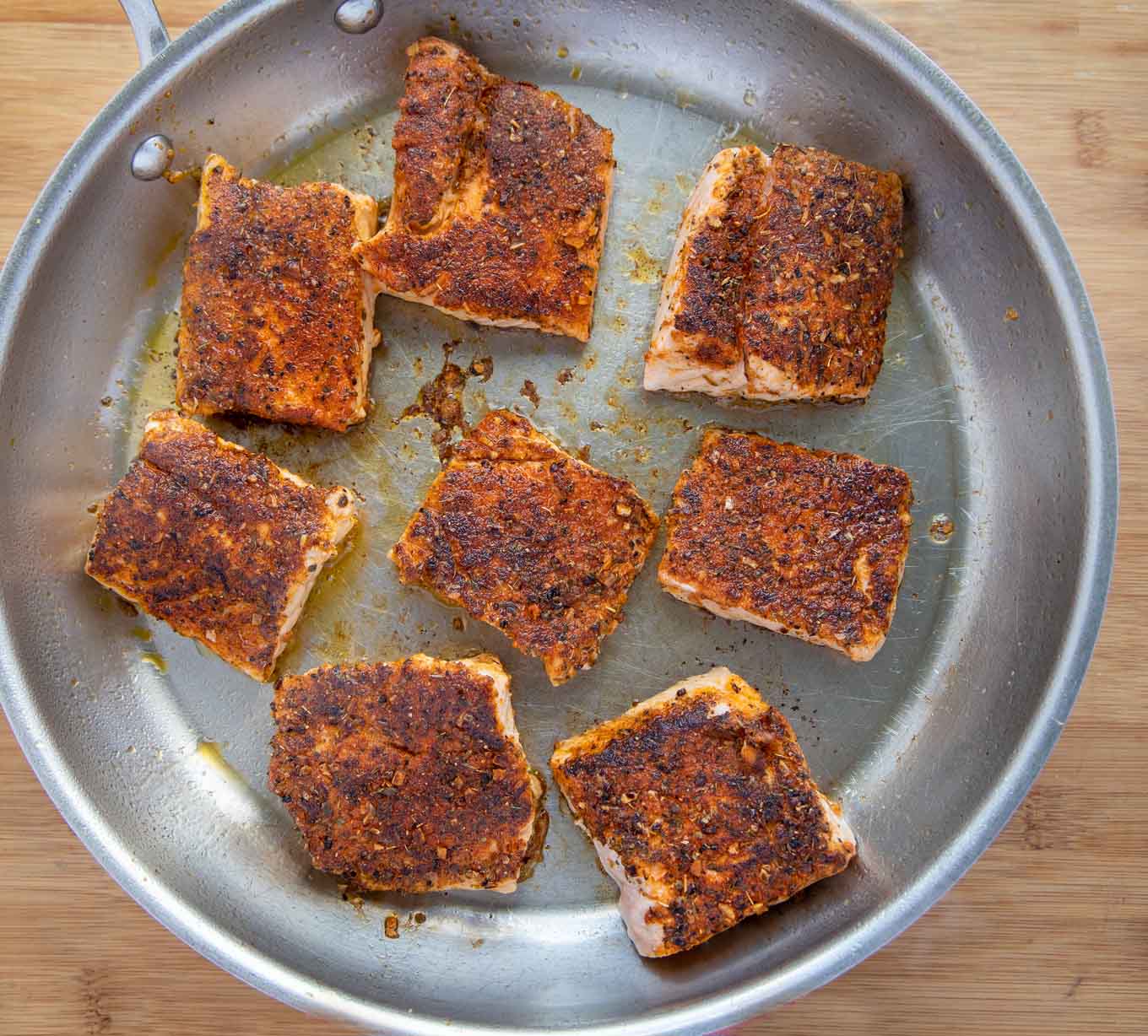 blackened salmon in a large saute pan