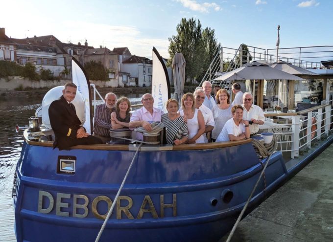 Captain and guests at the bow of the Luxury Barge the Deborah 