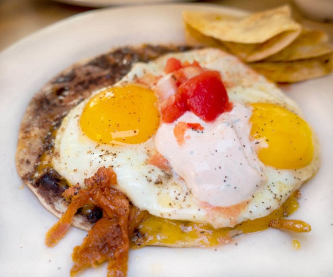 huevos rancheros on a white plate