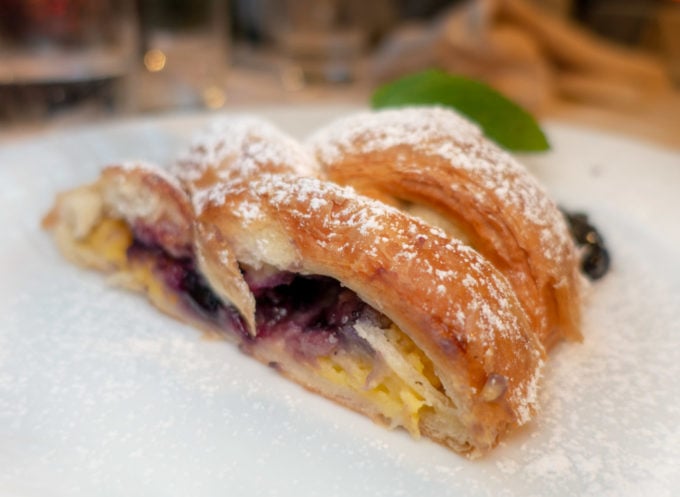 blueberry strudel on a white plate