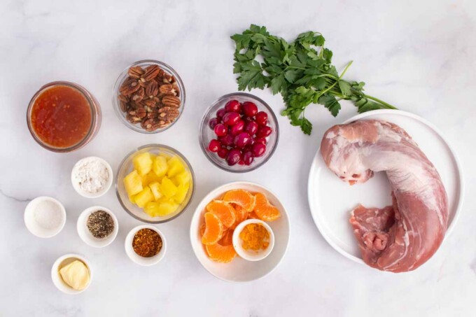 ingredients to make peppered pork loin with a sweet chili pecan fruit sauce