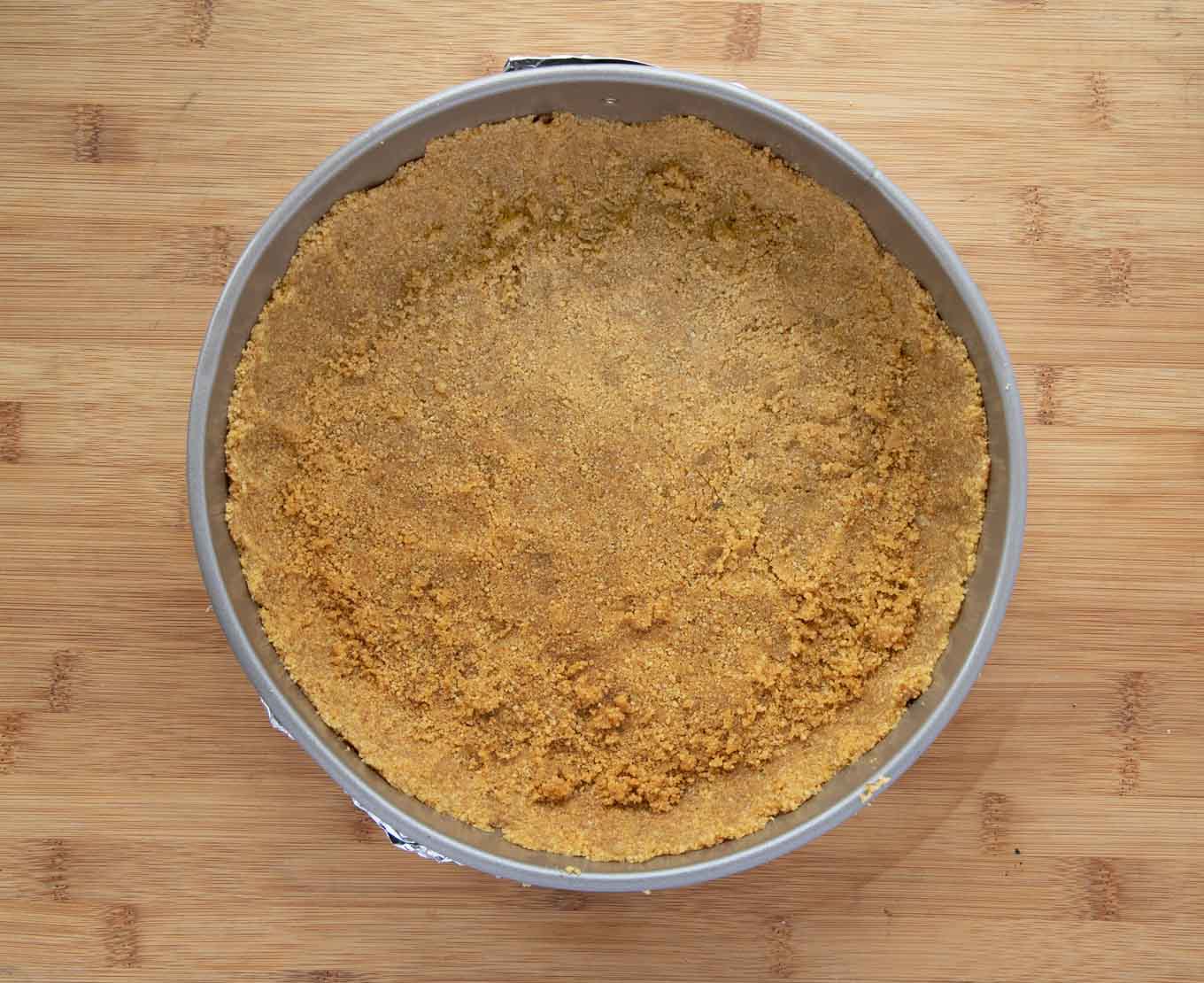 graham cracker crumb crust in a springform pan