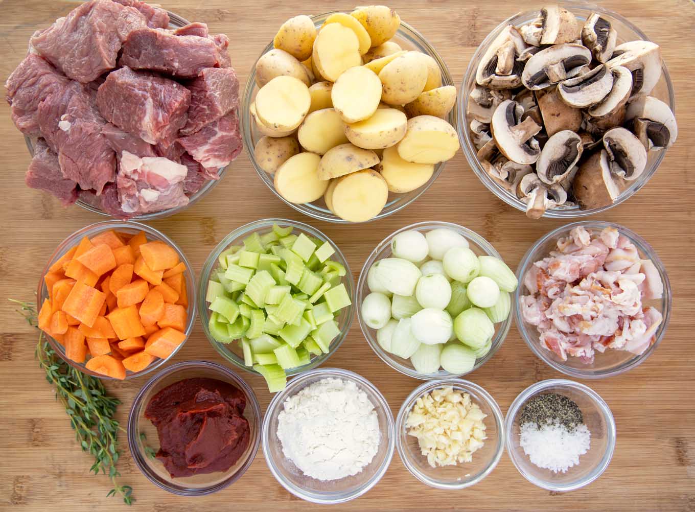 ingredients in glass bowls to make Guinness beef stew