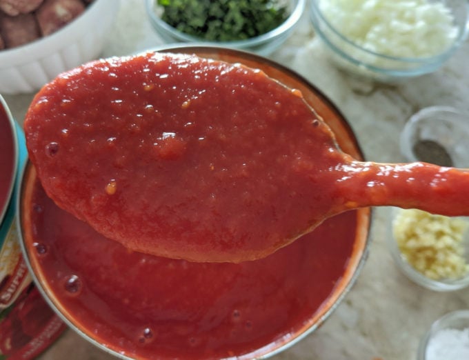 a large spoonful of pureed whole tomatoes 