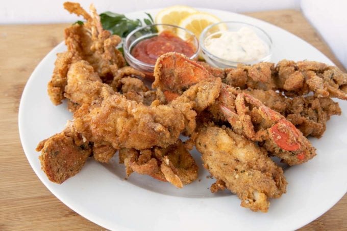 fried lobster tails on a white plate