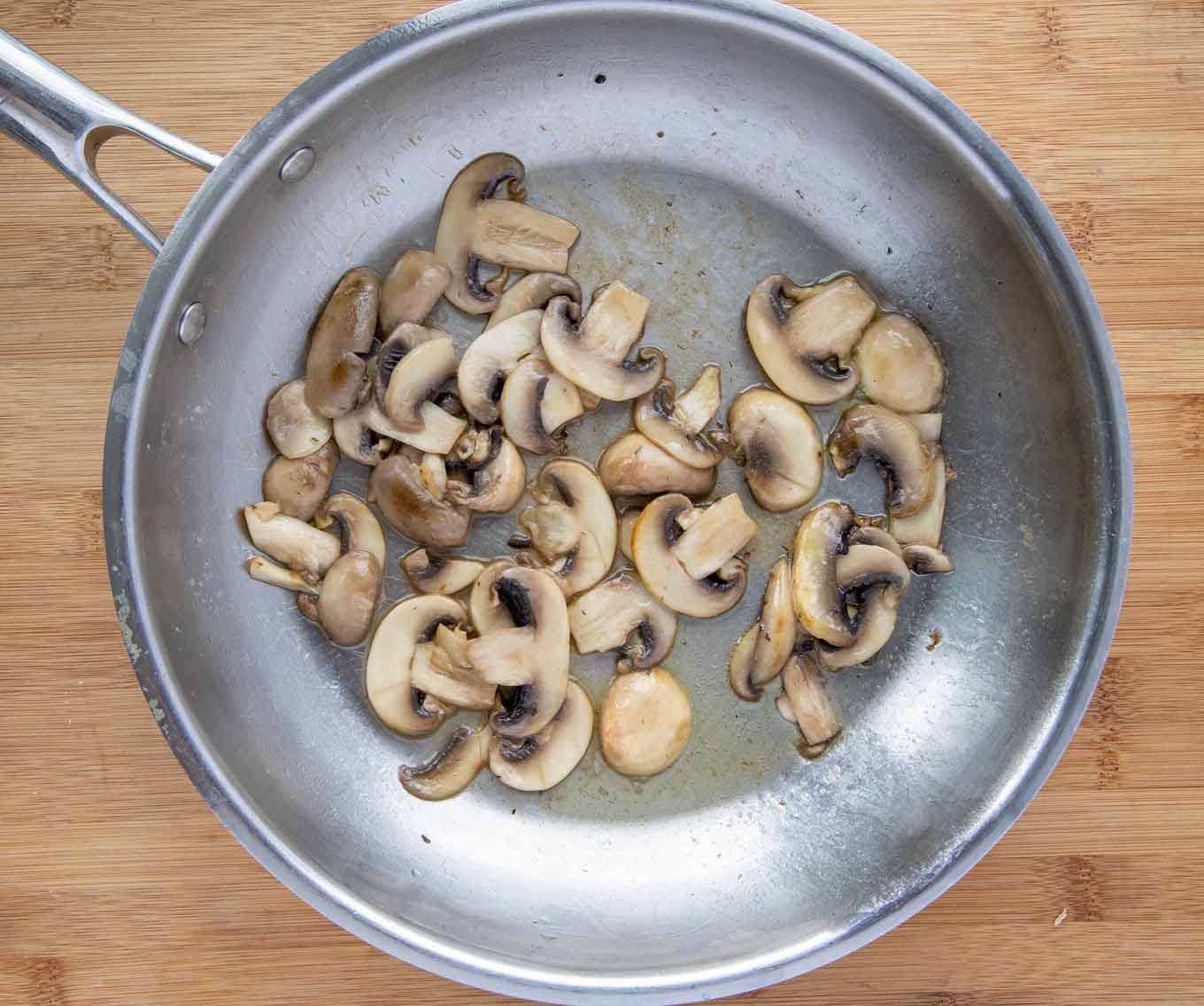 cooked mushrooms in a saute pan.