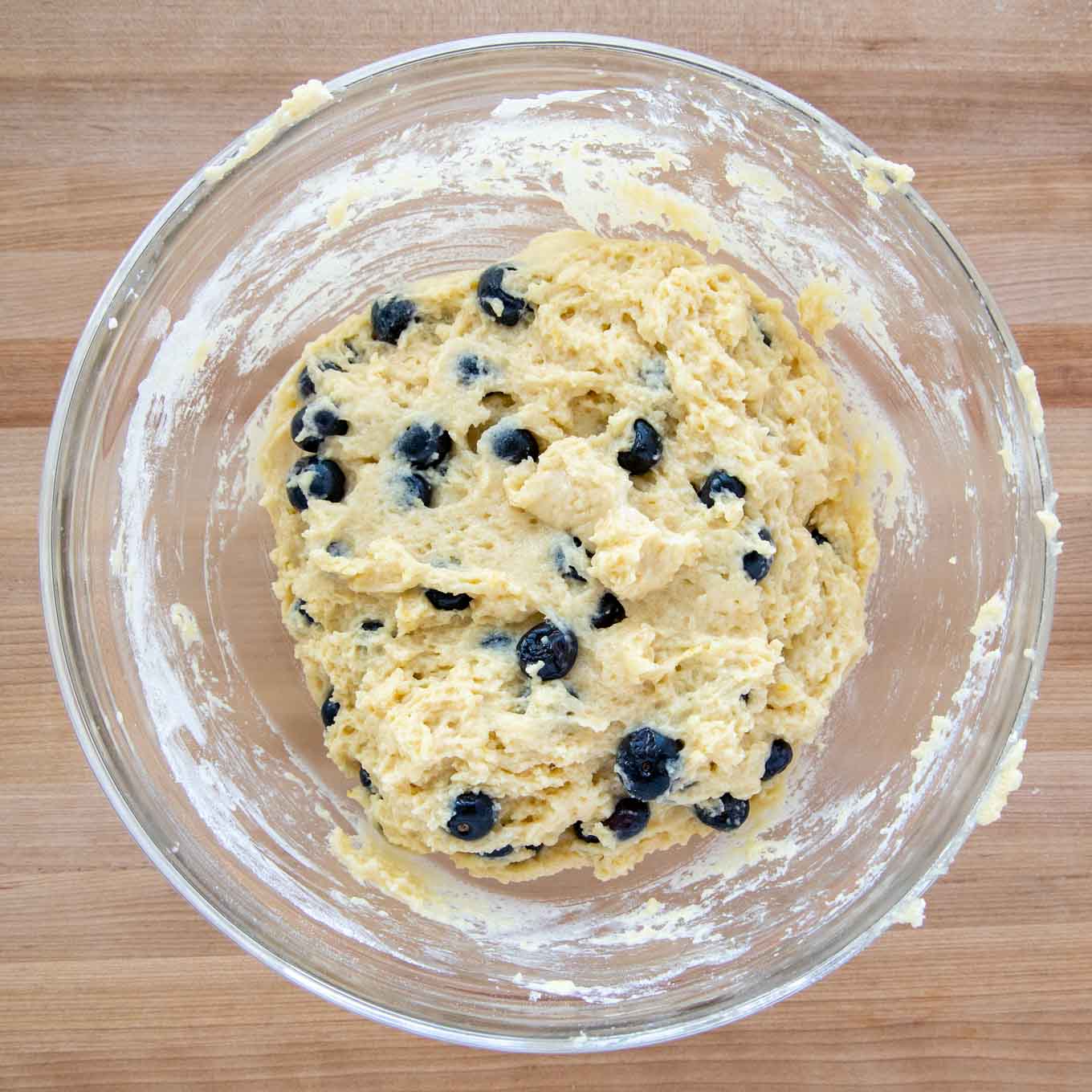 blueberry muffin batter in a glass bowl 