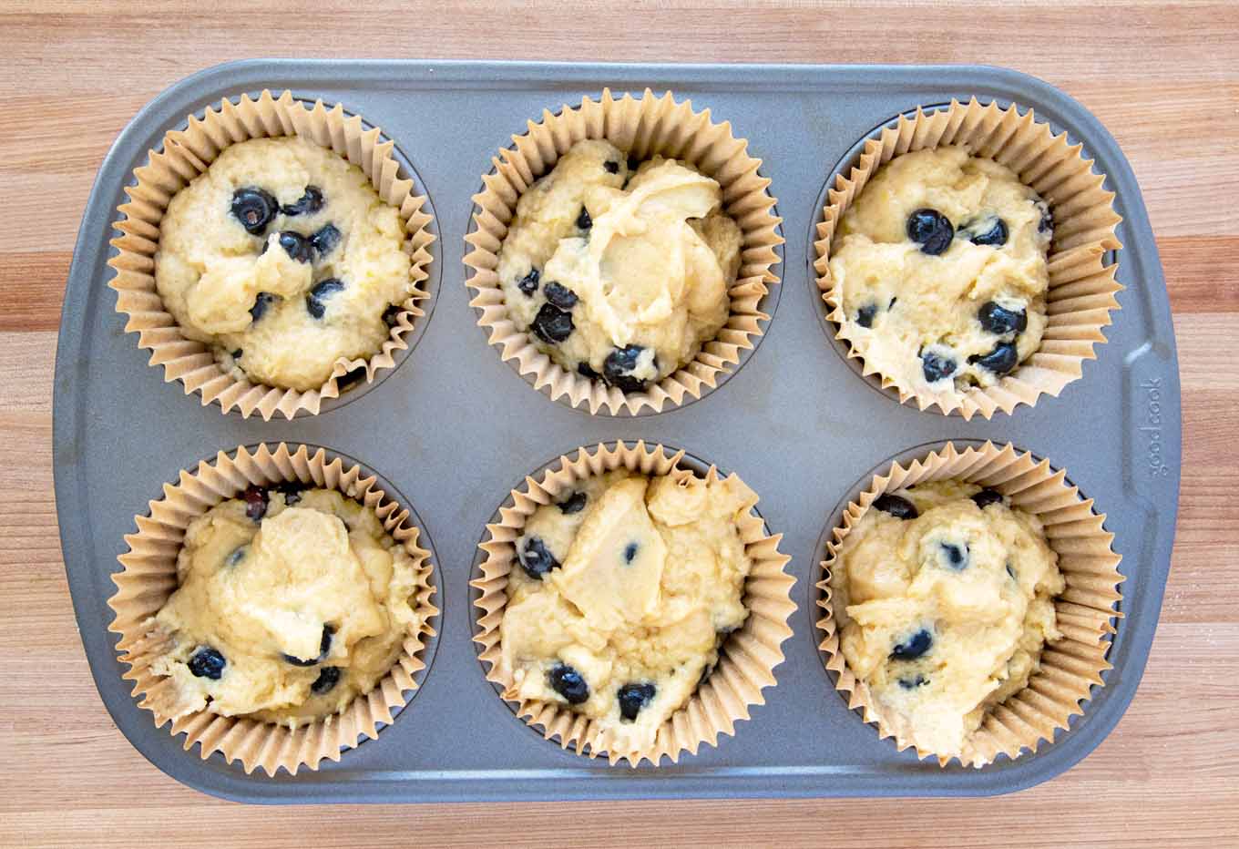 muffin batter in cupcake liners in a 6 muffin tin