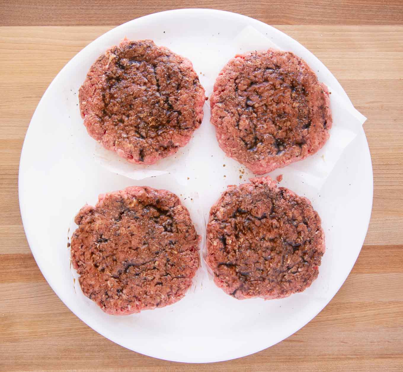 4 hamburgers brushed with worcestershire sauce, salt and pepper