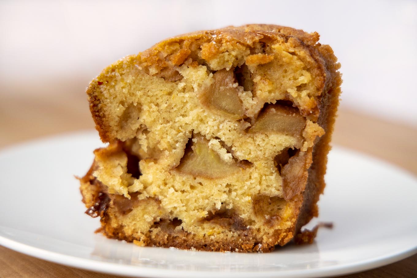 slice of Jewish apple cake on a white plate