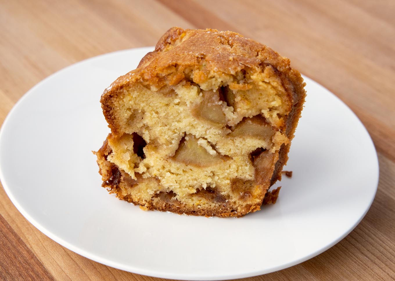 slice of Jewish apple cake on a white plate