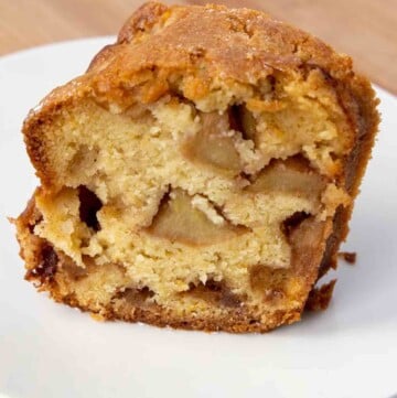 slice of jewish apple cake on a white plate