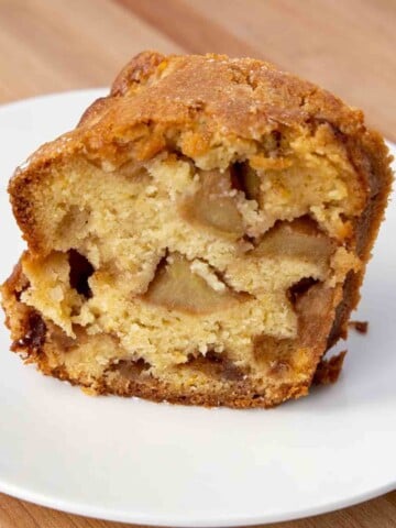 slice of jewish apple cake on a white plate