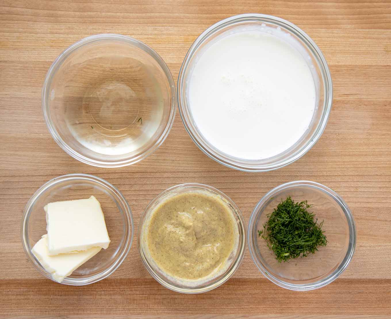 overhead view of ingredients to make dijon dill sauce