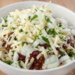 close up of Cincinnati chili five ways in a white bowl