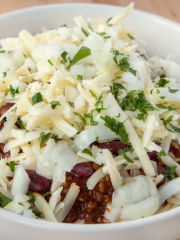 close up of Cincinnati chili five ways in a white bowl