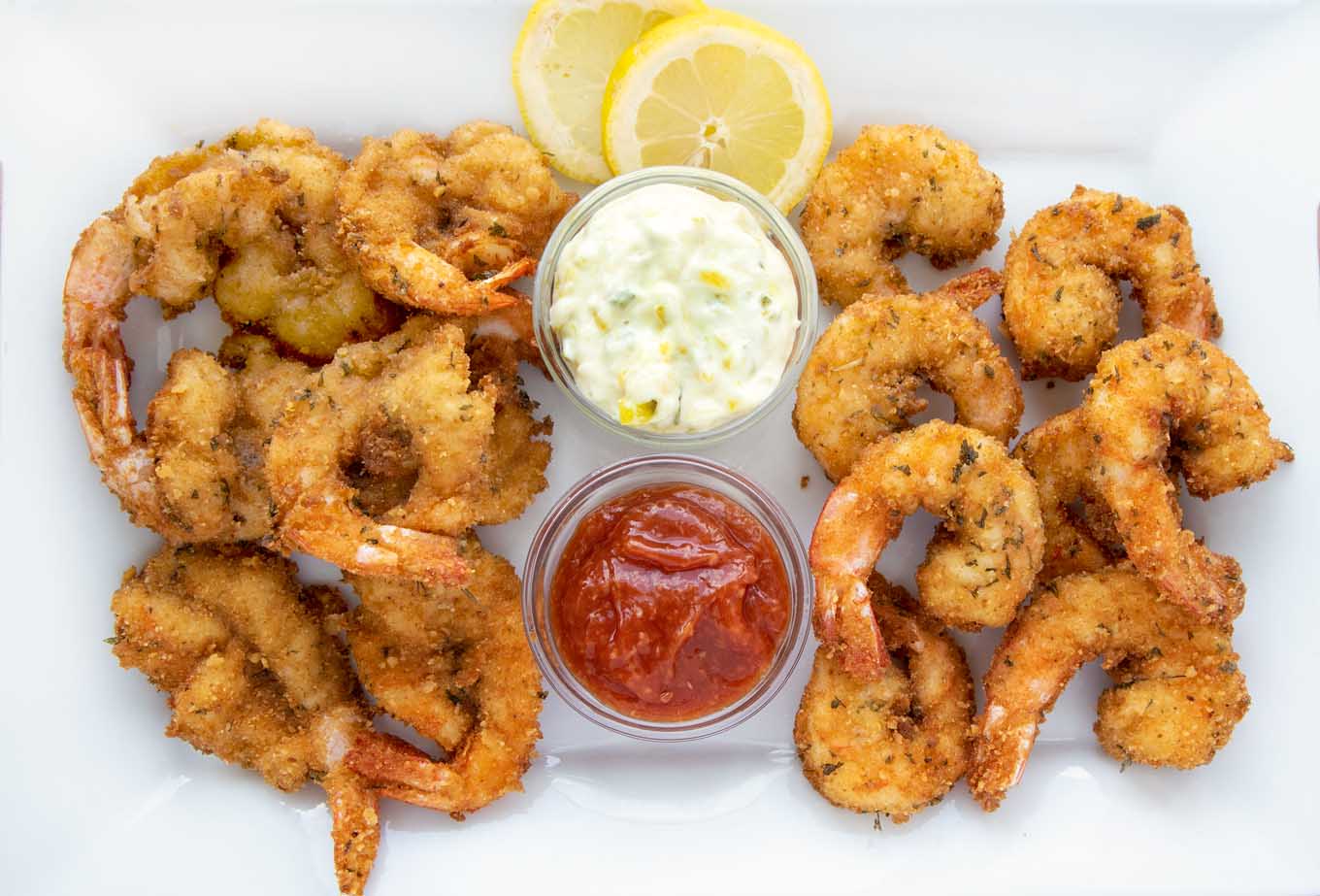 fried shrimp platter with cocktail sauce and tarter sauce