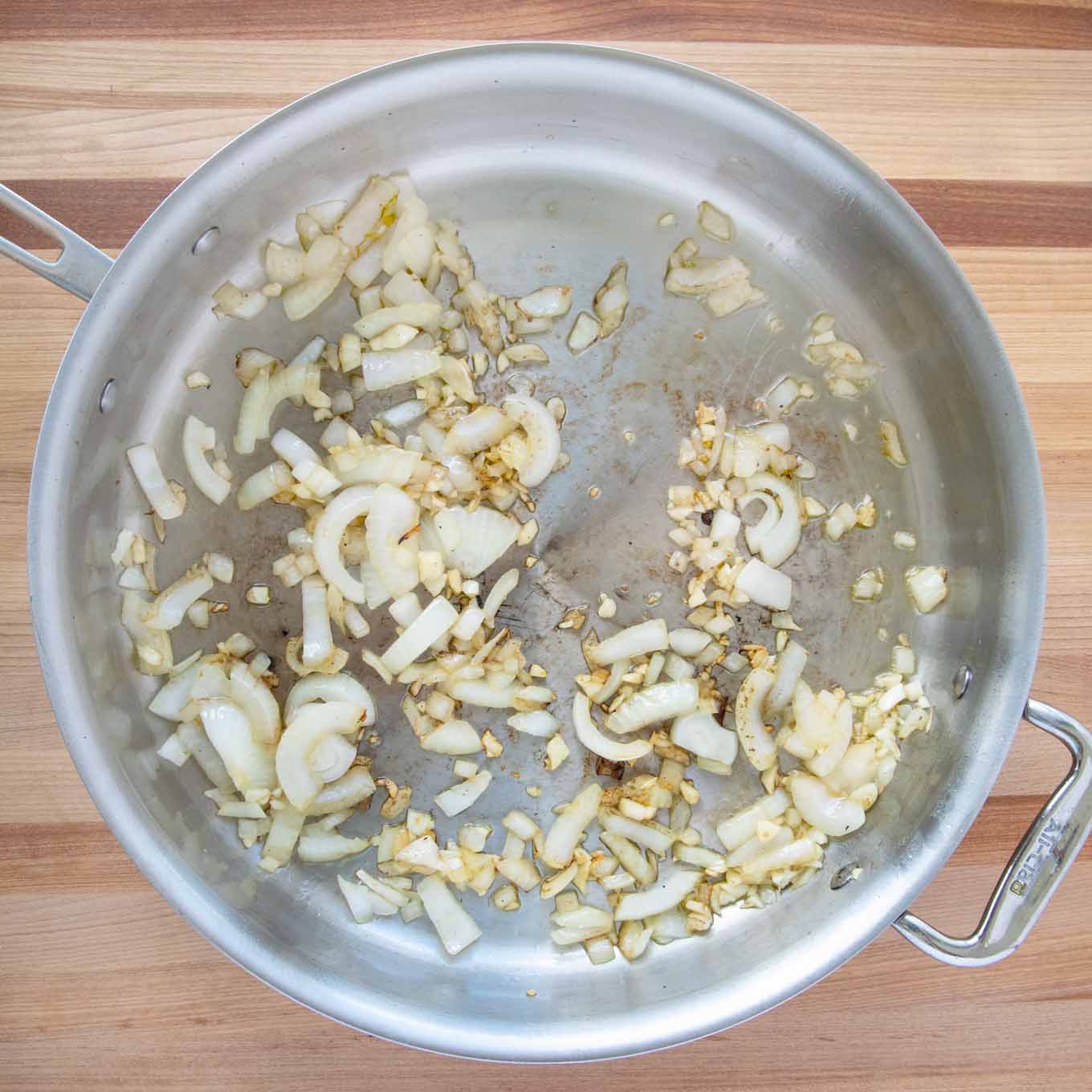 onions and garlic cooking in a large pot