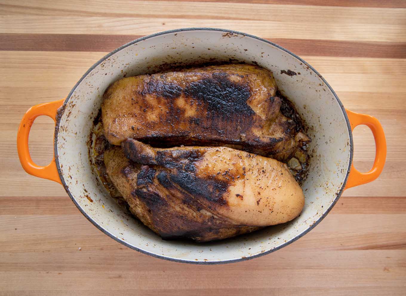 seared pork roasts in a dutch oven