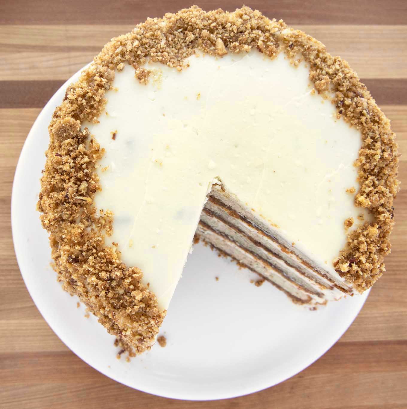 overhead view of banana crunch cake with ¼ of the cake cut out
