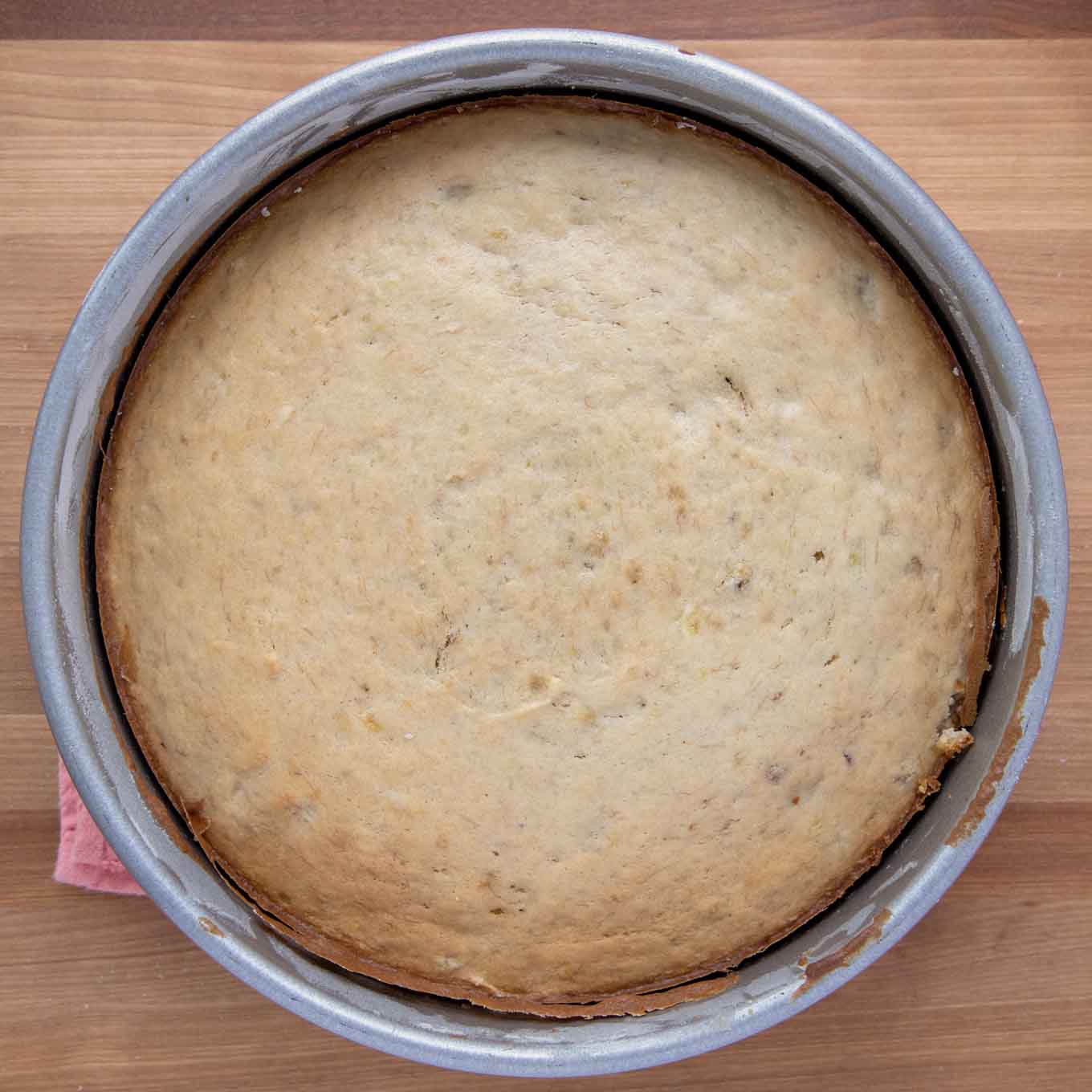 golden brown banana cake in cake pan