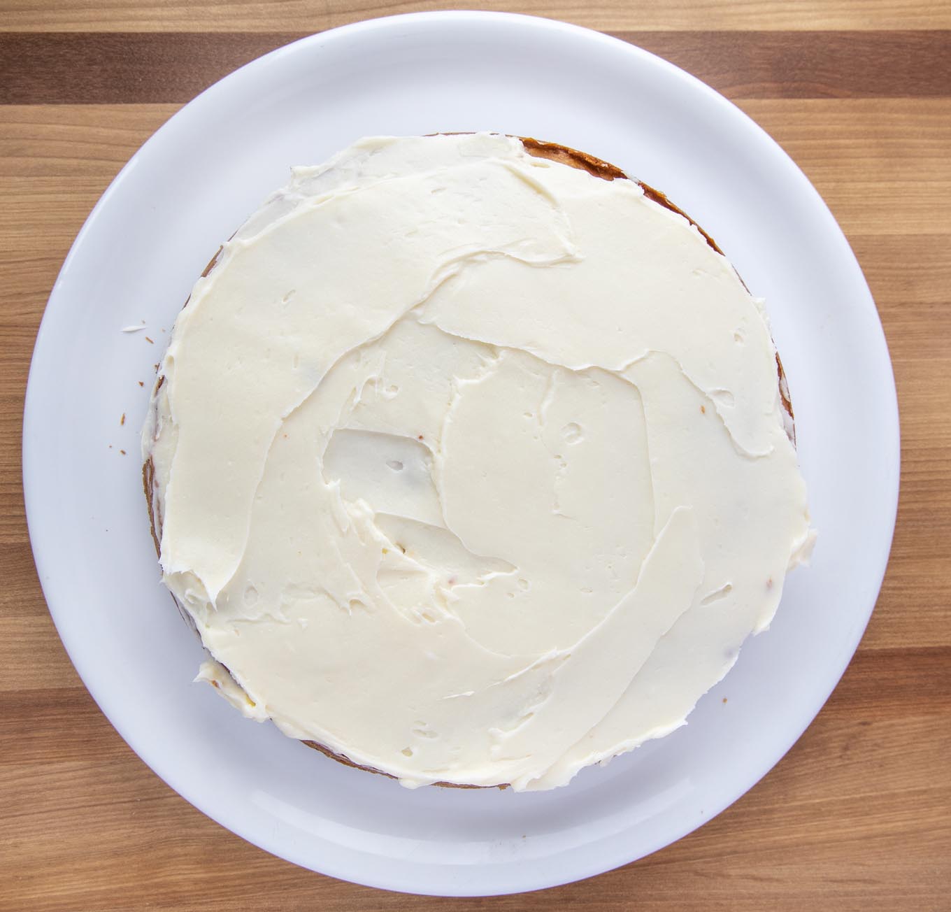 layer of banana cake frosted with cream cheese frosting