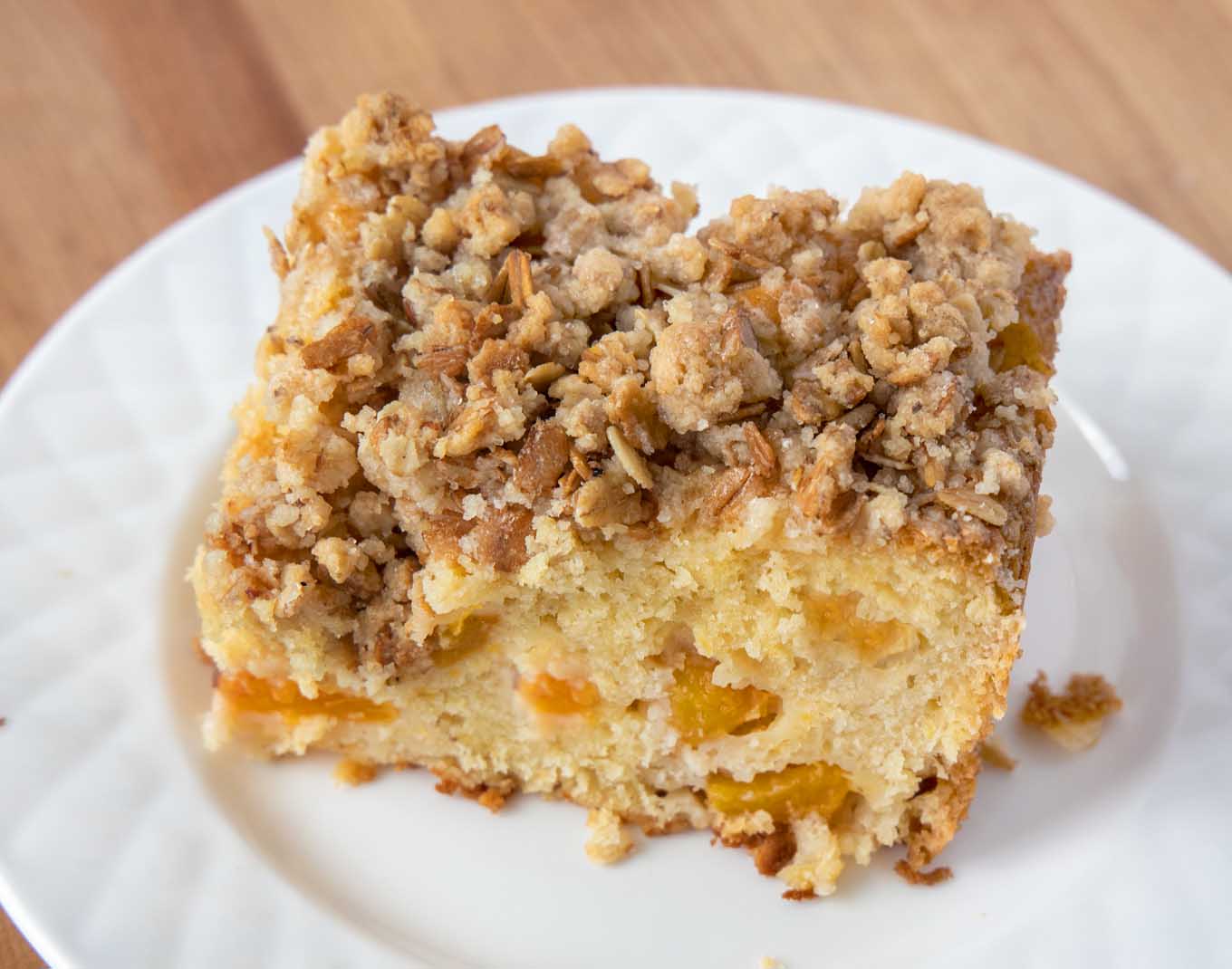 slice of peach buckle on a white plate