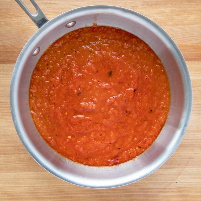 overhead view of pureed roasted red peppers in a sauce pan