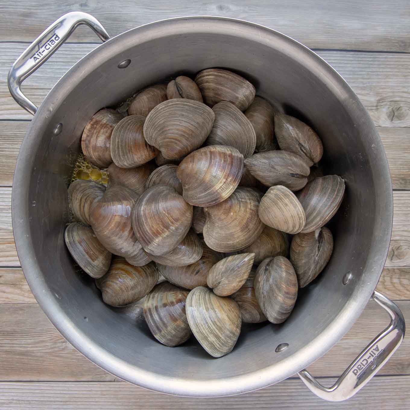 whole clams in stock pot