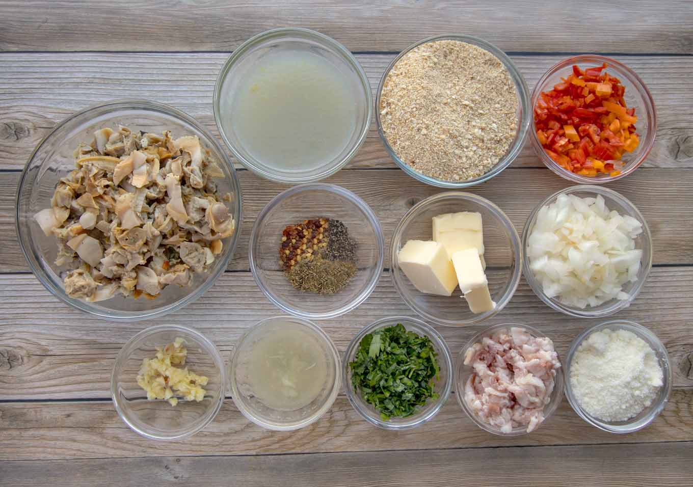 ingredients to make deviled clams in glass bowls
