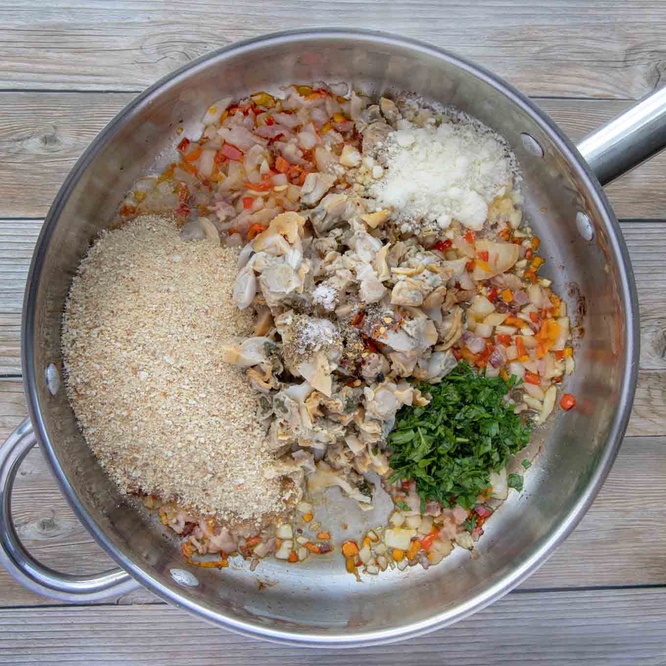 ingredients to make deviled clams in a large skillet