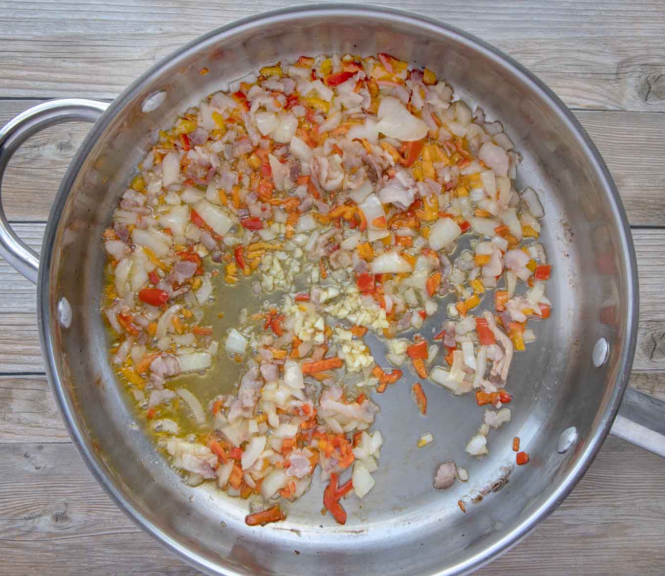 sauteed peppers and onions in a large skillet