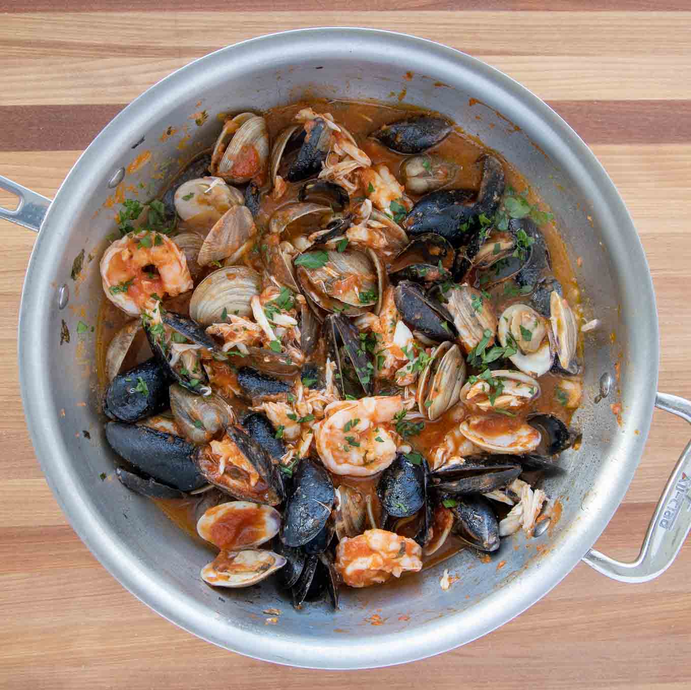 finished seafood marinara in a large saute pan