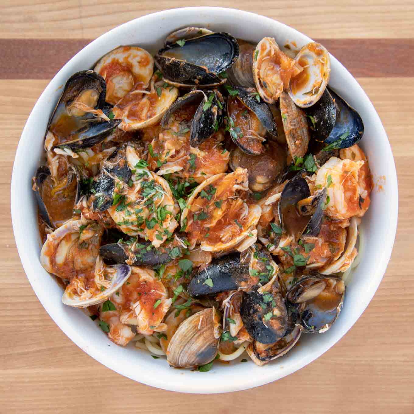 seafood marinara in a white bowl